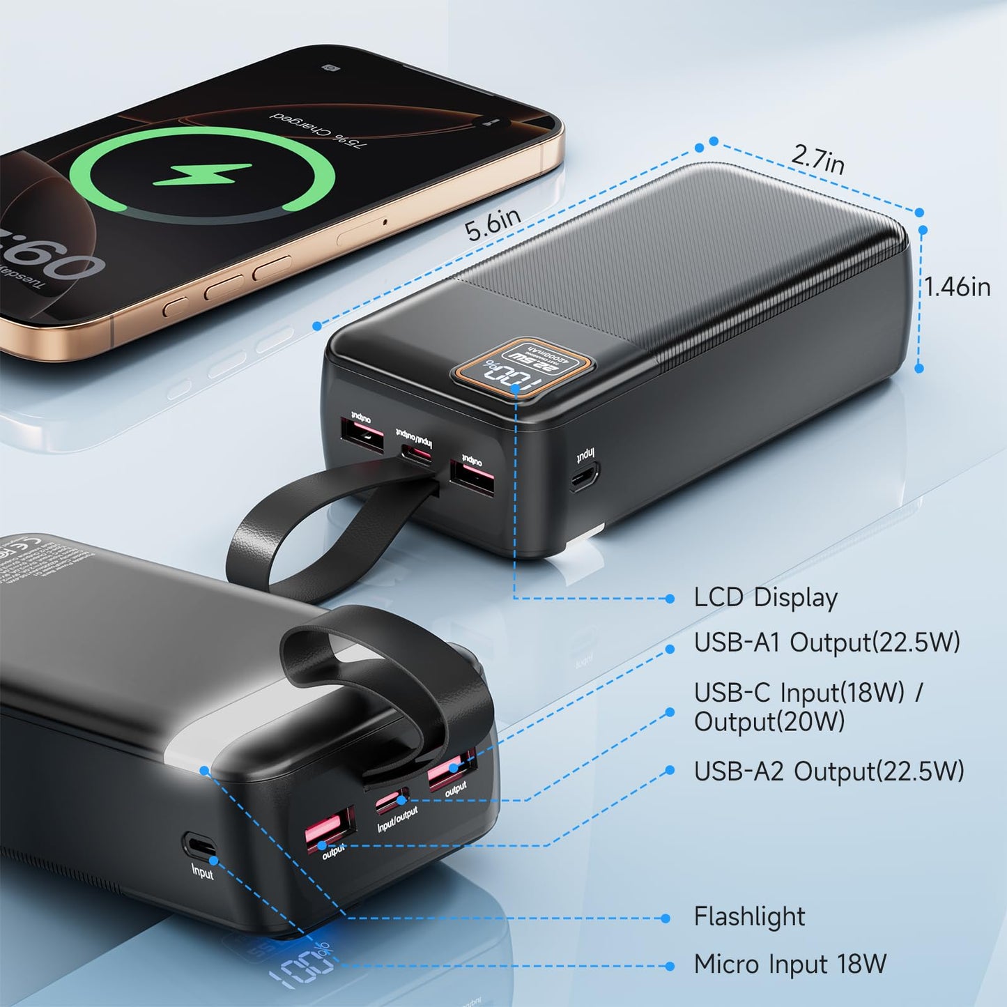 Black power bank with multiple charging ports and a smartphone showing charging status on a light blue background.